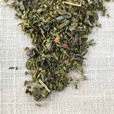 Moroccan Mint tea by Code 3 Rescue Coffee and Tea served in a clear glass cup with fresh mint leaves and brewed tea.