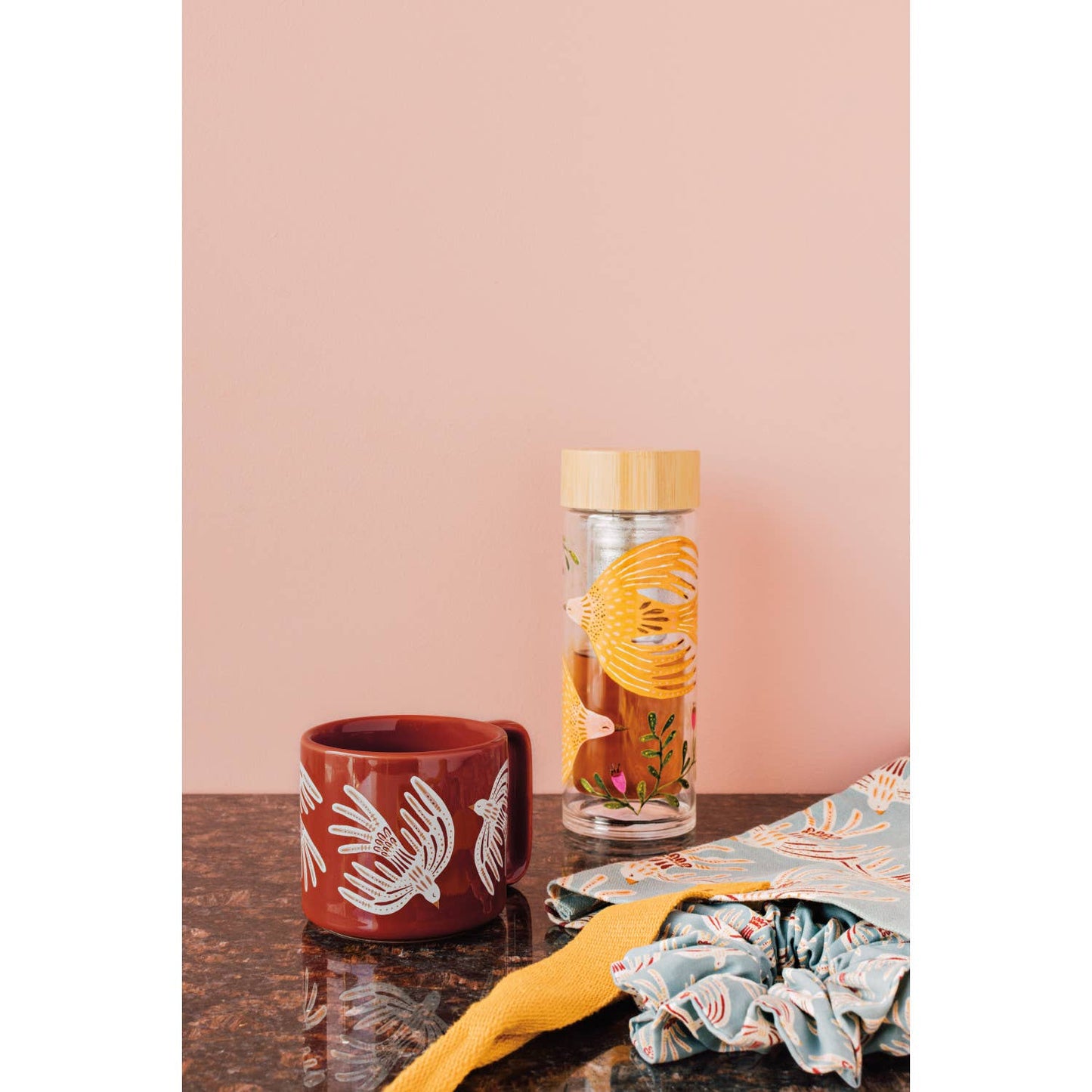 Slowly Danica Studio Plume Sustain Tea Infuser, stainless steel bird-shaped tea strainer with floral accents, for brewing loose leaf tea.