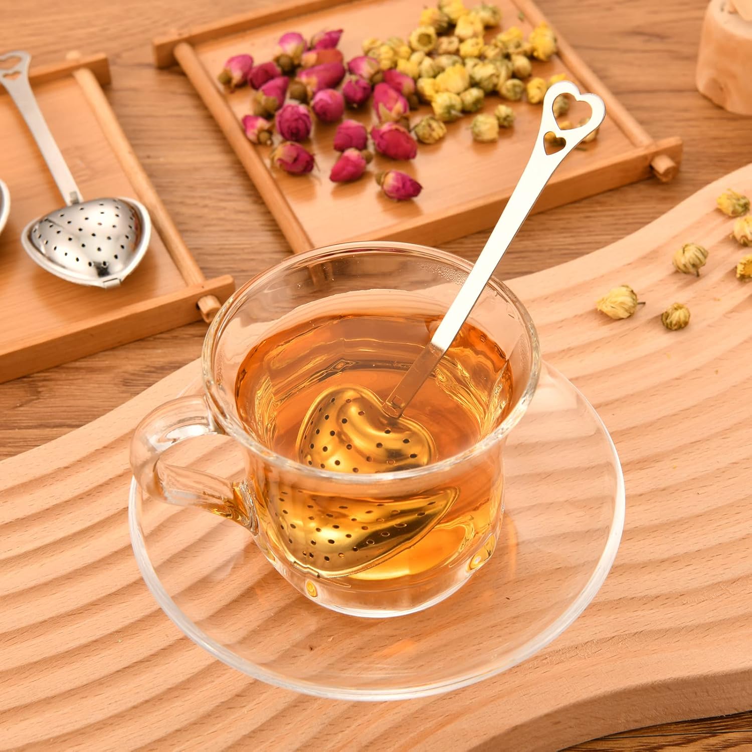 Heart-shaped tea infuser from Sage & Stone Apothecary, perfect for brewing loose leaf tea in a charming kitchen accessory.