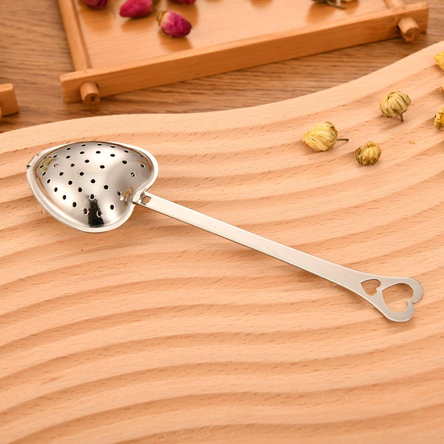 Heart-shaped tea infuser from Sage & Stone Apothecary for brewing loose leaf tea and infusions in a charming kitchen accessory.