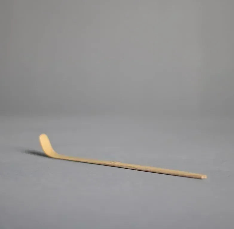 Perfecsy Japanese bamboo whisk for matcha tea, with prongs for blending powder and green tea, used as a tea ceremony accessory.