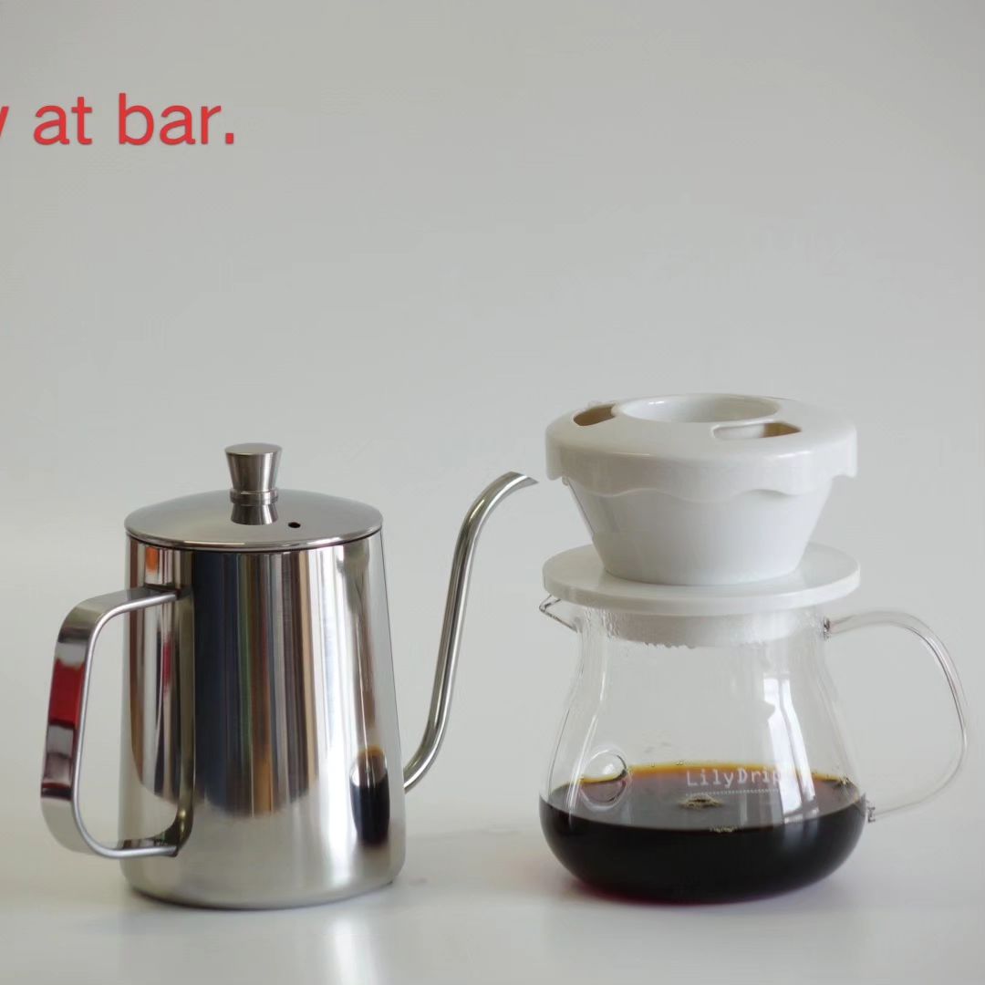 LilyDripper pour over coffee dripper by LilyDrip USA, ceramic device with a cone shape and ridged interior for brewing coffee.