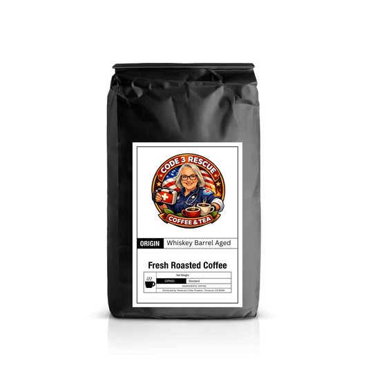 Code 3 Rescue Coffee whiskey barrel-aged coffee beans in a rustic barrel, highlighting dark roast and aging process.
