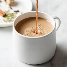 Code 3 Rescue Coffee and Tea Masala Chai in a white mug, showcasing a warm, spiced tea with aromatic flavors on a cozy table.