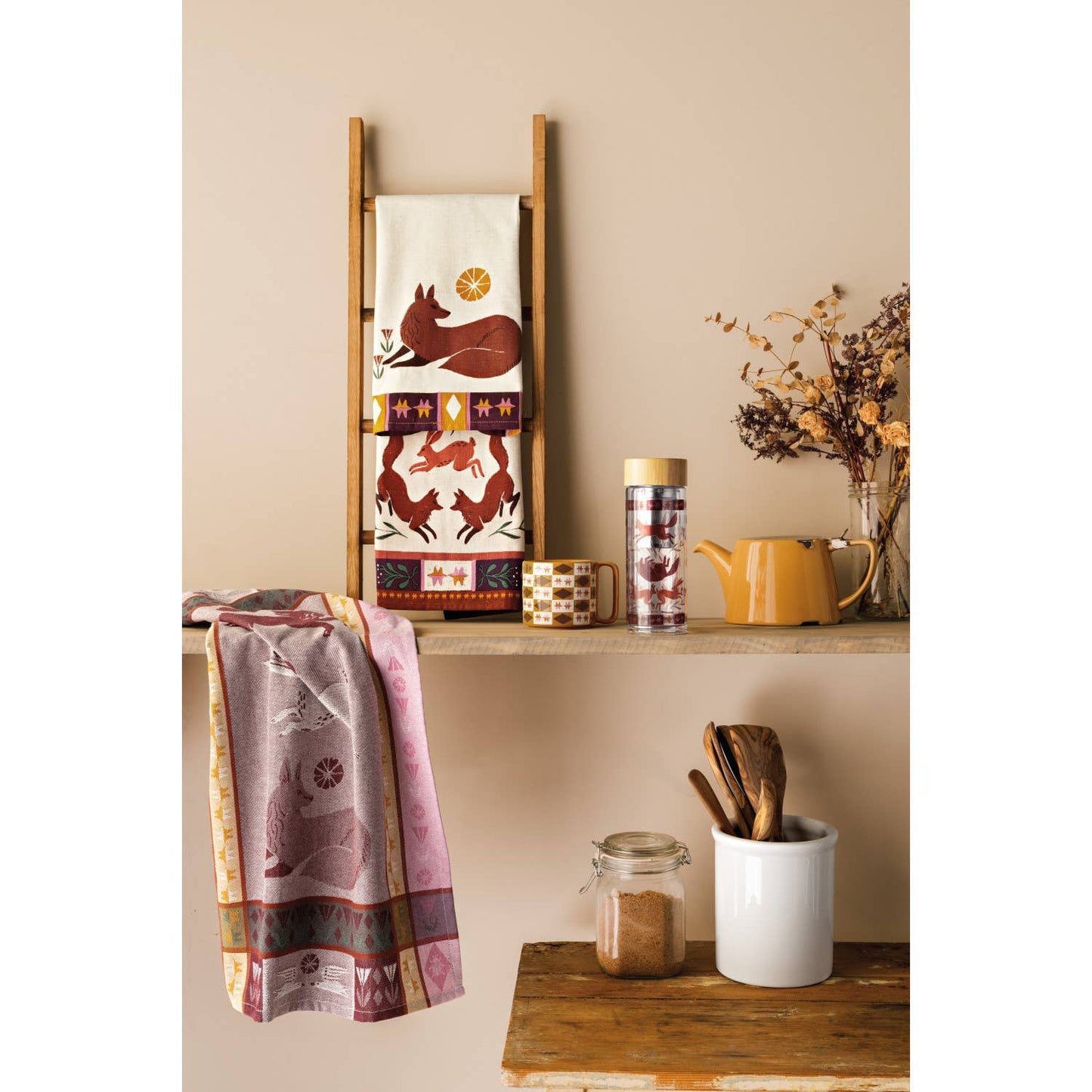 Slowly Danica Studio Folktale glass tea infuser bottle with stainless steel infuser and elegant design for brewing tea on the go.