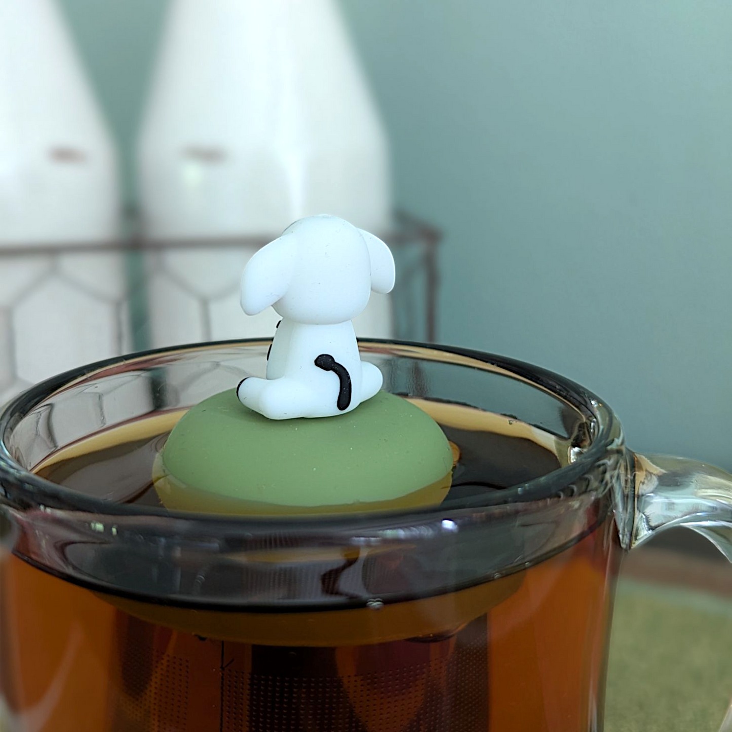 Floating spotted cow tea infuser from Float2infuse LLC, a cute animal-shaped teaware for loose leaf tea brewing.