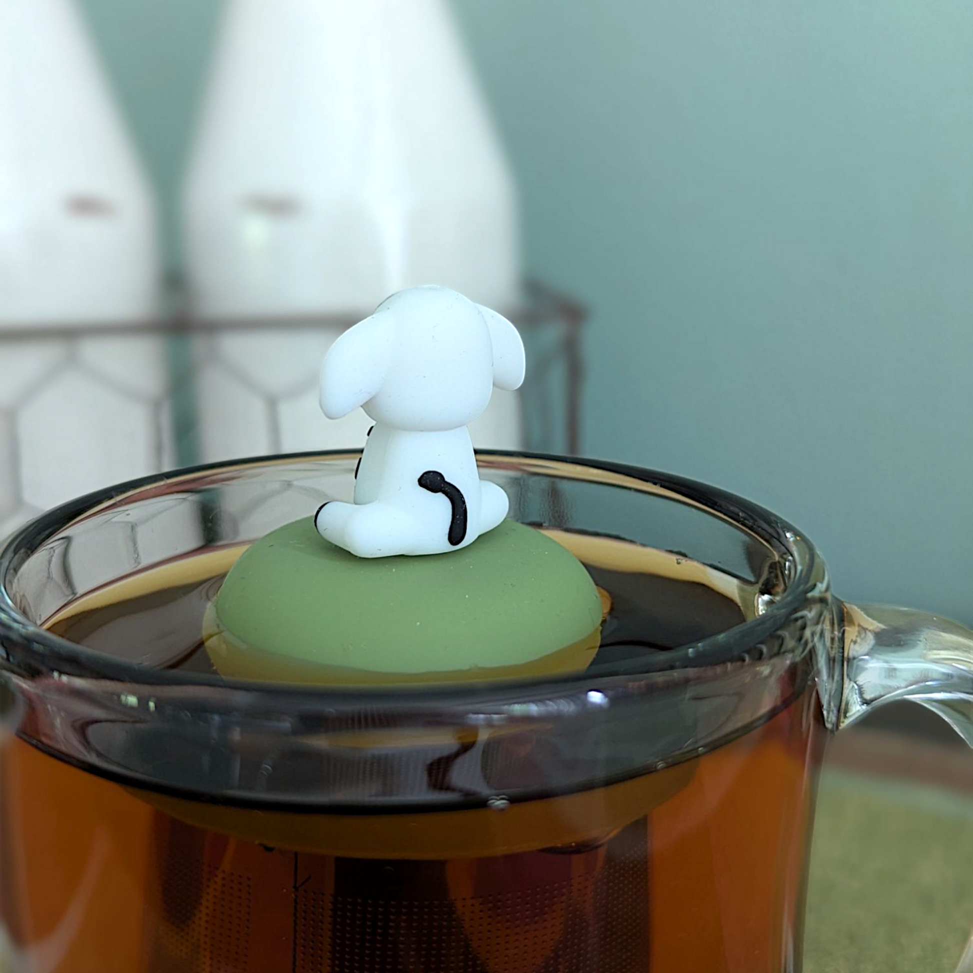 Floating spotted cow tea infuser from Float2infuse LLC, a cute animal-shaped teaware for loose leaf tea brewing.