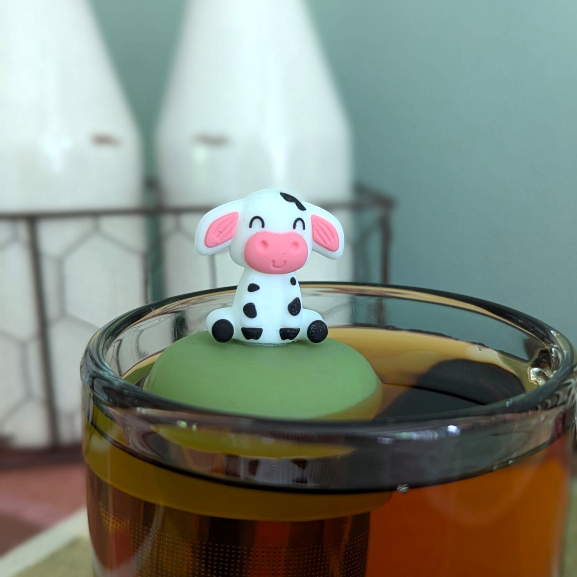 Floating Spotted Cow tea infuser by Float2infuse LLC, a cute animal-shaped teaware for loose leaf tea brewing.